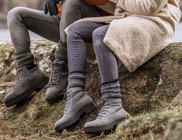 couple wearing heat holders socks with boots